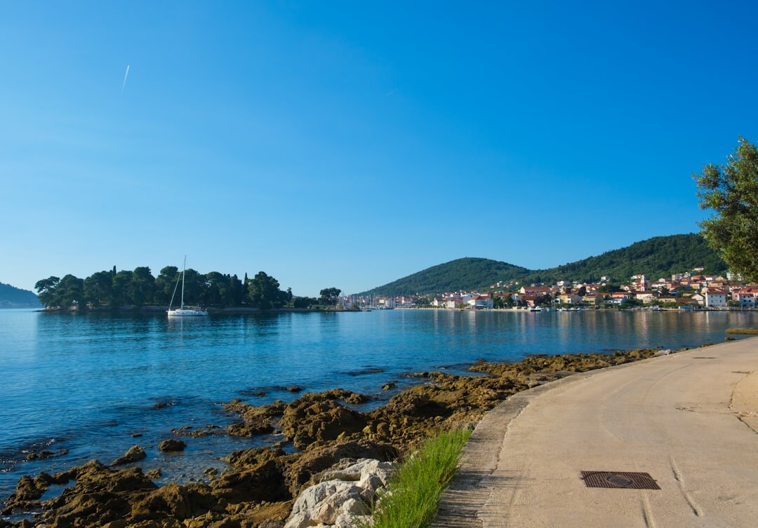 Seniors exploring the old stone streets of a Croatian coastal town