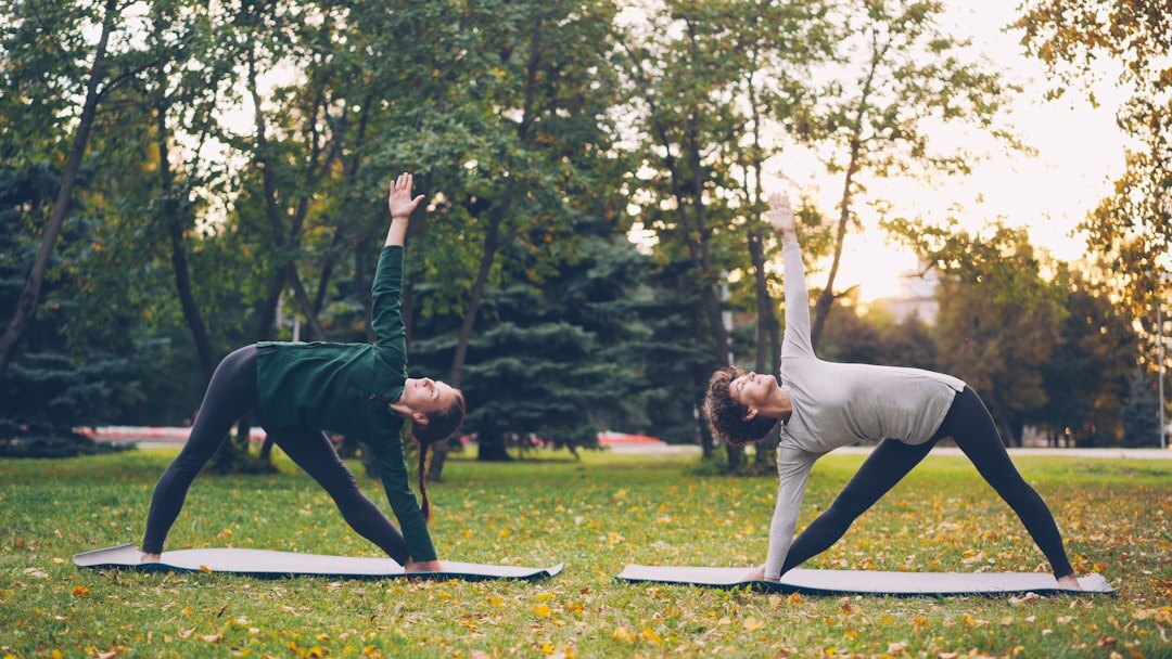 Seniors practicing gentle yoga and stretching outdoors