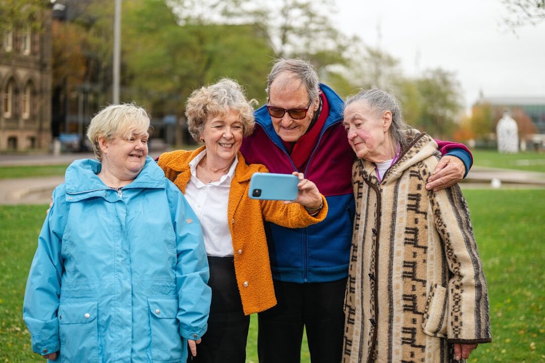 elderly friends talking in park